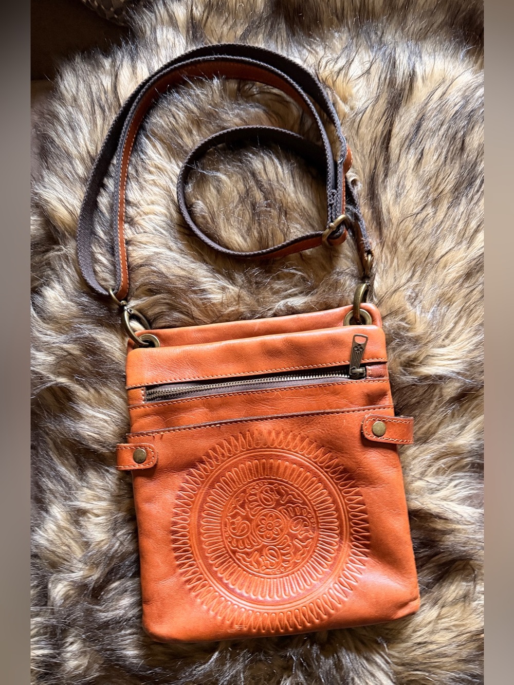 Patricia Nash Francesca hand-tooled leather organizer crossbody bag.